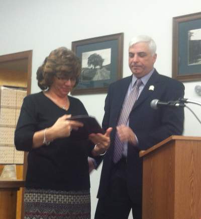 Mayor Marino presenting a plaque to Borough Clerk Doreen Schott being recognize for her 20 years